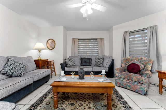 living room featuring ceiling fan and light tile patterned floors