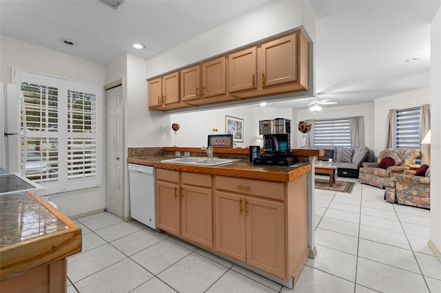 kitchen with white appliances, light tile patterned flooring, sink, and ceiling fan