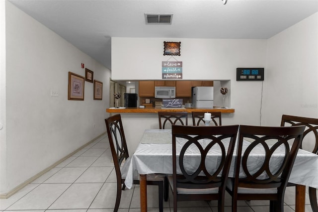 view of tiled dining space