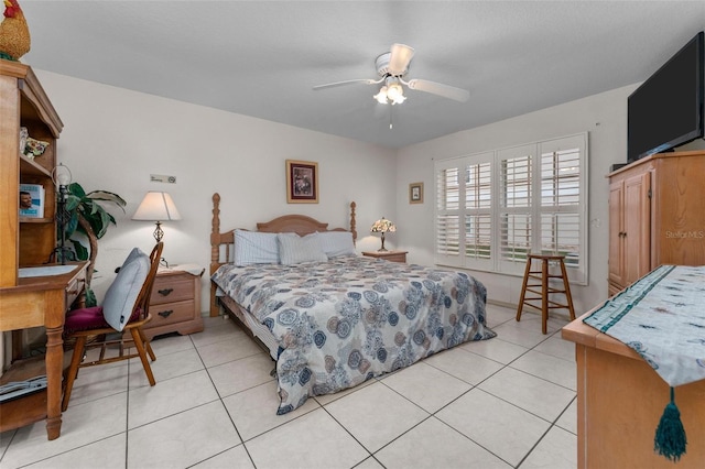 tiled bedroom with ceiling fan