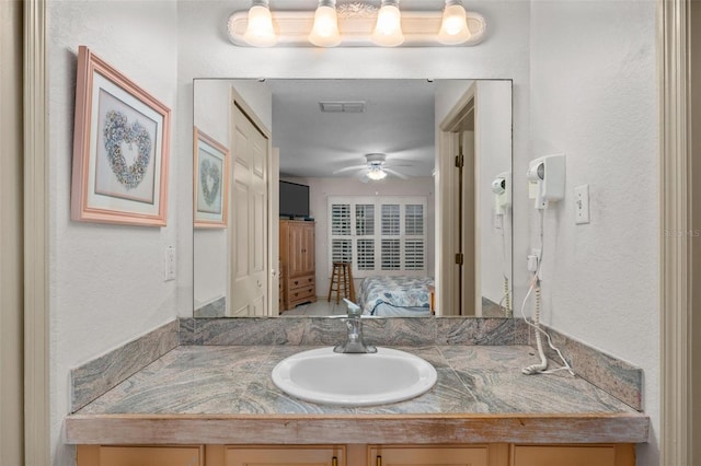 bathroom with vanity and ceiling fan