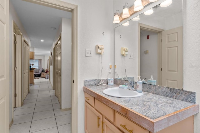 bathroom with tile patterned floors and vanity