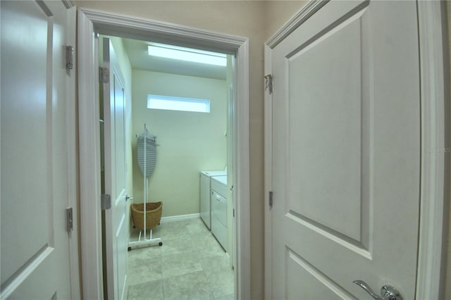 bathroom featuring washing machine and dryer