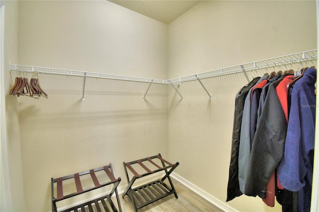 walk in closet featuring hardwood / wood-style floors