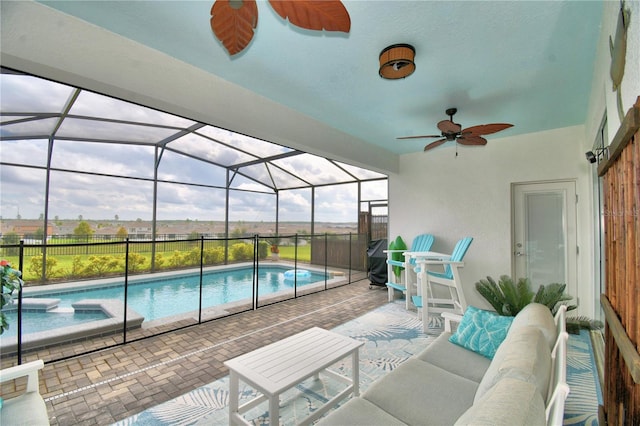 view of swimming pool with a lanai, a patio, an outdoor hangout area, ceiling fan, and grilling area