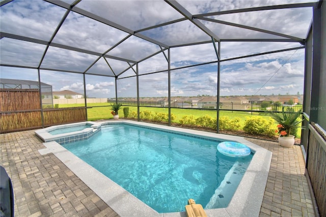 view of swimming pool featuring a patio, glass enclosure, and an in ground hot tub