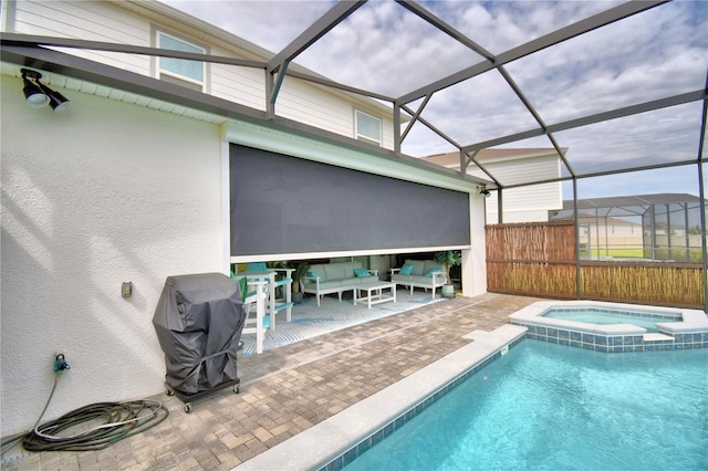 view of swimming pool with a lanai, a grill, an in ground hot tub, and a patio area