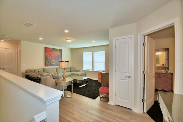 living room with light hardwood / wood-style flooring