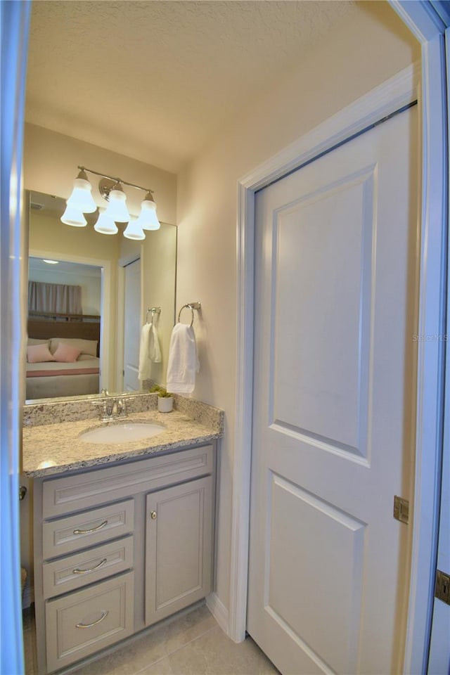 bathroom with vanity and tile patterned floors