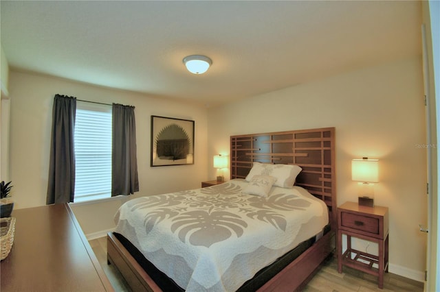 bedroom with light hardwood / wood-style flooring