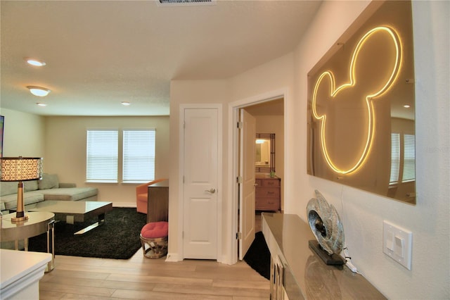 living room with light hardwood / wood-style flooring