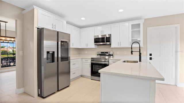 7972 Snowberry Cir, Orlando, FL 32819 - kitchen featuring white cabinets, glass insert cabinets, a sink, stainless steel appliances, and light stone countertops