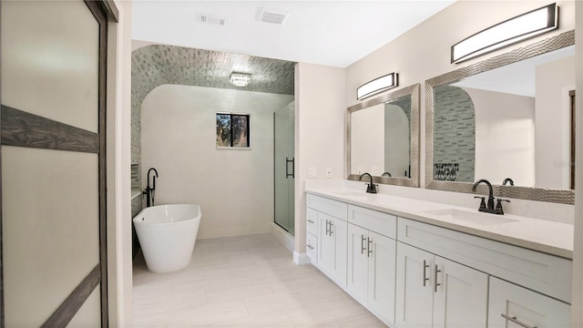 bathroom with independent shower and bath and vanity