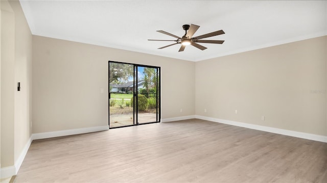 empty room with crown molding, ceiling fan, and light hardwood / wood-style flooring