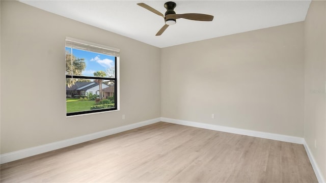 unfurnished room with light wood-type flooring and ceiling fan