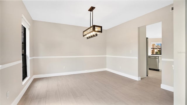 unfurnished dining area with light hardwood / wood-style flooring