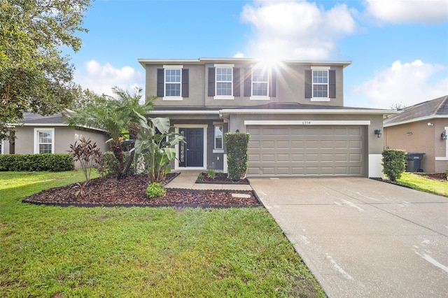 view of front property with a front yard and a garage