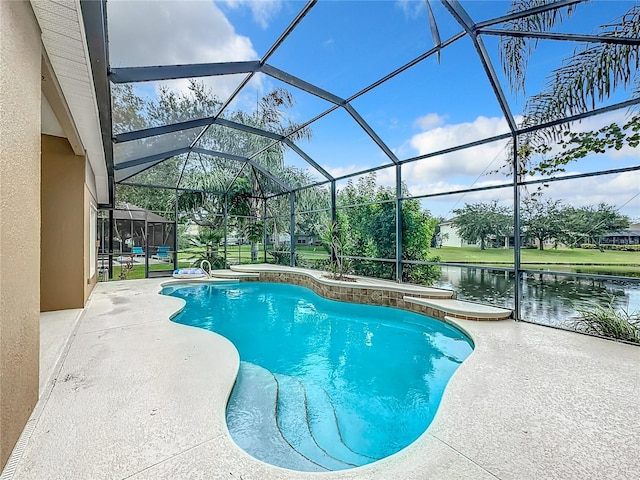 view of swimming pool with a patio, a water view, and a lanai