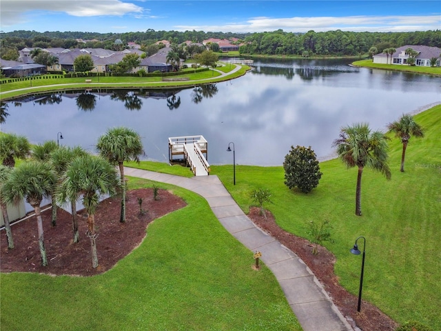 birds eye view of property with a water view