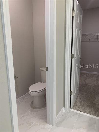 bathroom featuring toilet