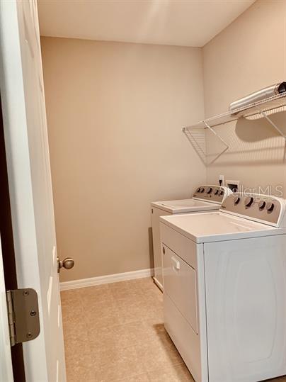 laundry area with washer and dryer