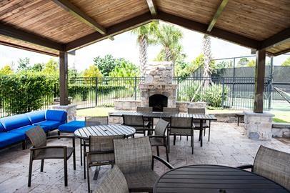 view of patio featuring an outdoor living space with a fireplace