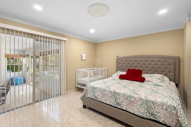 bedroom with ornamental molding and access to exterior