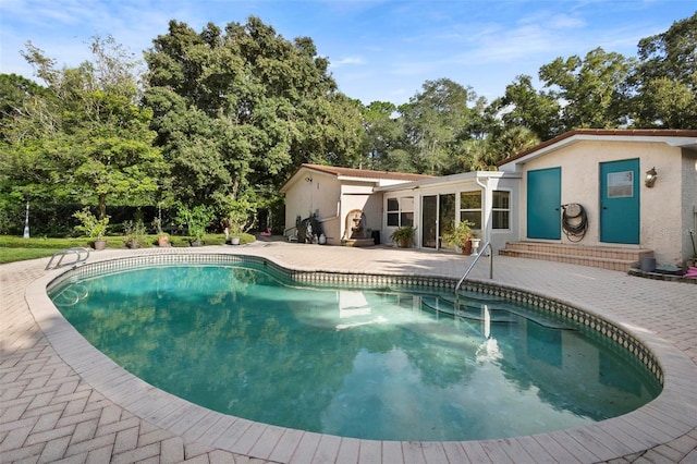 view of pool featuring a patio