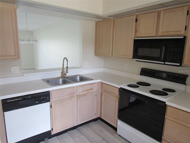 kitchen with light brown cabinetry, white appliances, sink, and light hardwood / wood-style flooring