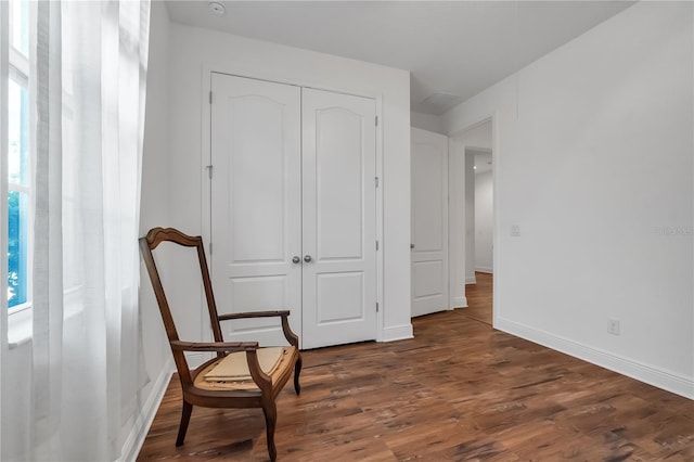 sitting room featuring dark hardwood / wood-style floors