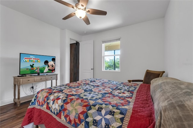 bedroom featuring ceiling fan and dark hardwood / wood-style flooring