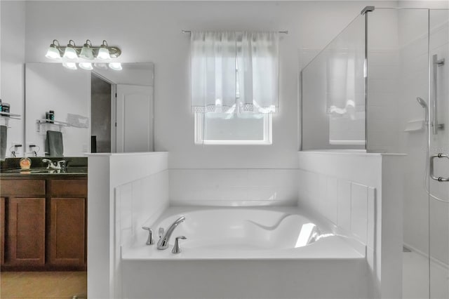 bathroom featuring vanity and separate shower and tub