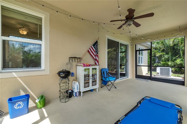 view of patio / terrace with ceiling fan and central AC