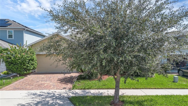 obstructed view of property with a garage