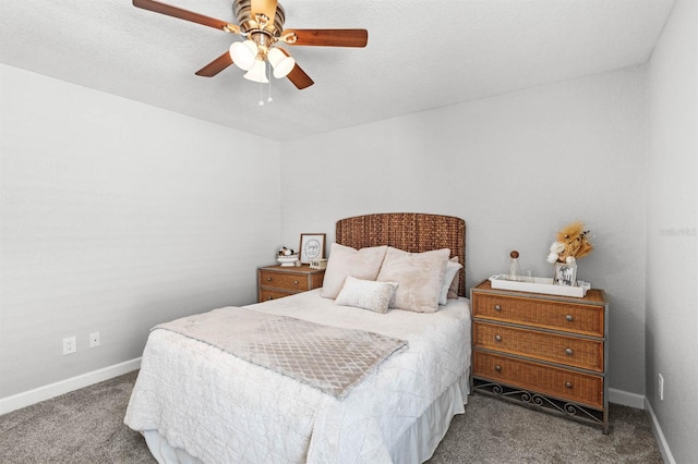 carpeted bedroom with ceiling fan and a textured ceiling