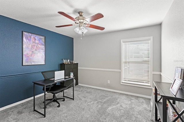 office space featuring ceiling fan, carpet floors, and a textured ceiling