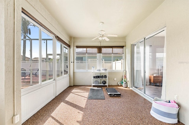 sunroom / solarium with ceiling fan