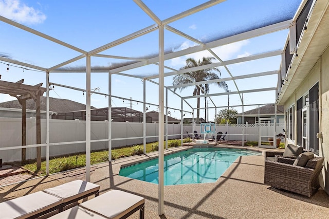 view of pool with a lanai and a patio area