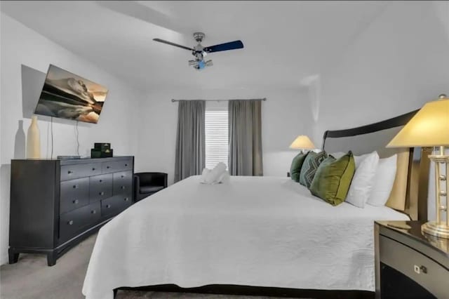 carpeted bedroom with ceiling fan