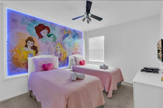 bedroom featuring ceiling fan and light carpet