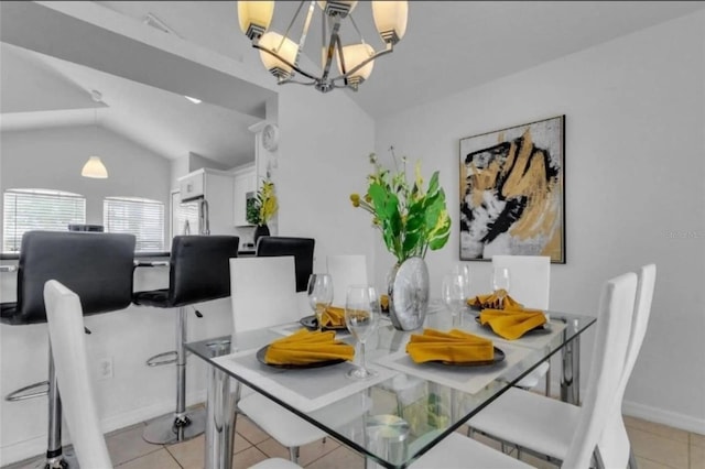 tiled dining room with vaulted ceiling and a chandelier