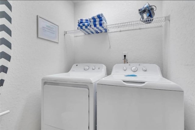 laundry area with washer and clothes dryer