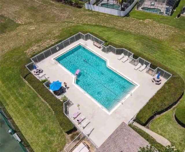 view of pool featuring a yard and a patio area