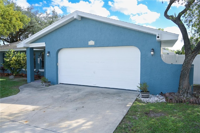 view of side of home featuring a garage