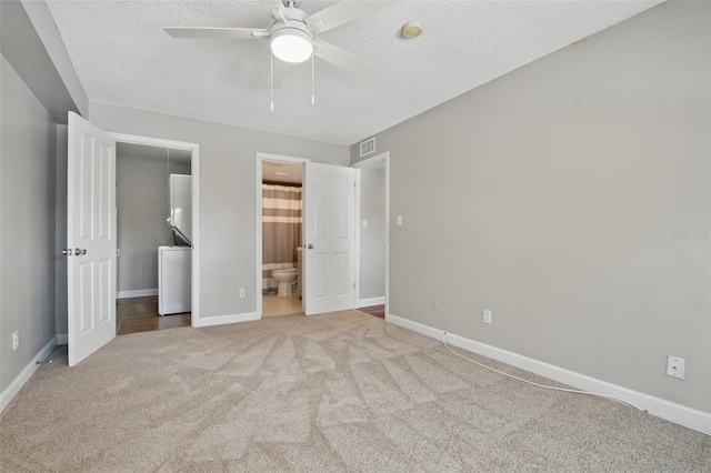 unfurnished bedroom featuring a textured ceiling, carpet, visible vents, and baseboards