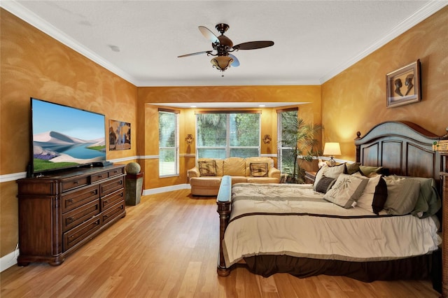 bedroom with ornamental molding, light hardwood / wood-style floors, and ceiling fan