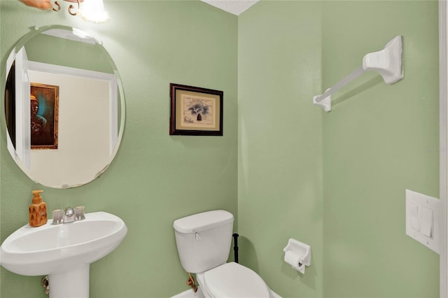 bathroom featuring sink and toilet