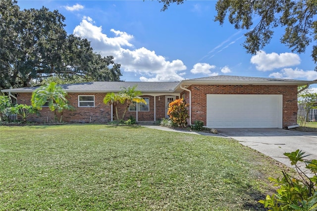 ranch-style home featuring a garage and a front yard