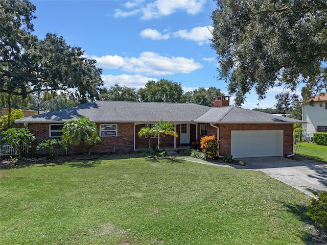 ranch-style house with a garage and a front lawn