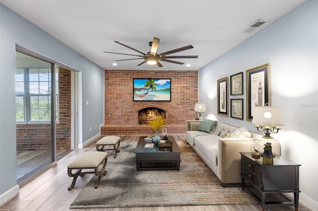 living room featuring ceiling fan and wood-type flooring